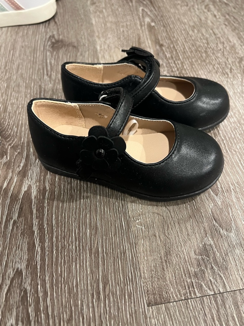 The Childrens Place Black Girls Mary Jane Dress Shoes with Flower Accent Toddler